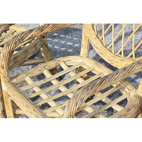 111 - A pair of vintage bamboo and wicker garden or conservatory chairs