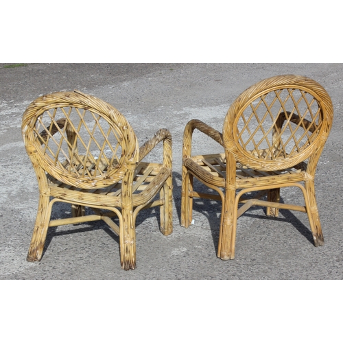 111 - A pair of vintage bamboo and wicker garden or conservatory chairs