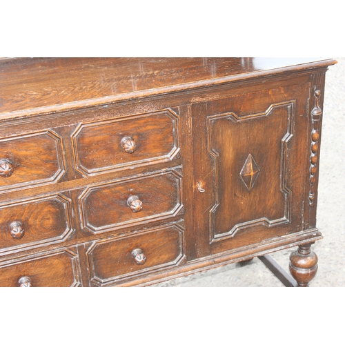 29 - An early 20th century oak court cupboard style sideboard, approx 152cm wide x 51cm deep x 143cm tall