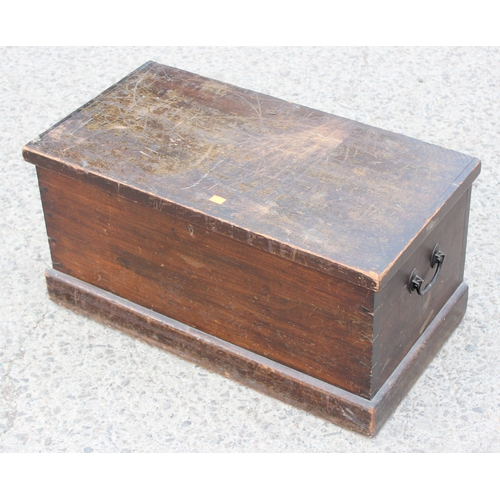 31 - An antique stained pine trunk, approx 68cm wide x 38cm deep x 34cm tall