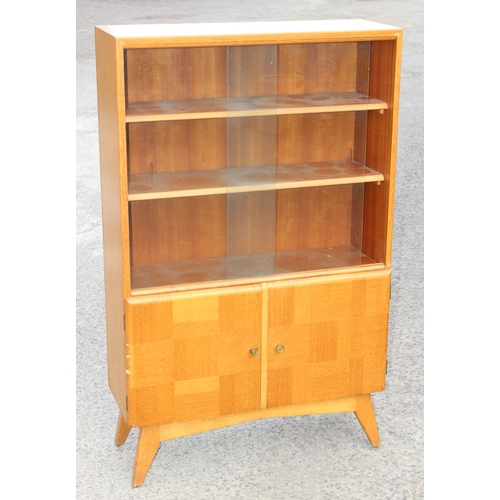 18 - An unusual mid-century oak veneered bookcase with unusual design, marked and dated to back 1960, app... 