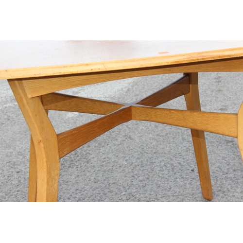 15 - A retro E Gomme G-Plan light oak drop leaf dining table and 4 chairs, all with gold stamped label, t... 