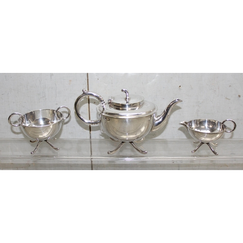 1007 - In the manner of Dr Christopher Dresser for Martin Hall & Co, an early 20th century 3 piece silver p... 