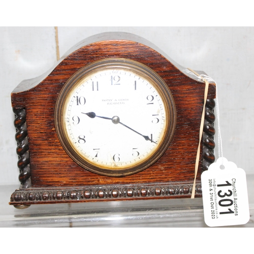 1301 - Small wooden mantel clock by Botley & Lewis of Reading with mechanical movement, approx 14cm tall