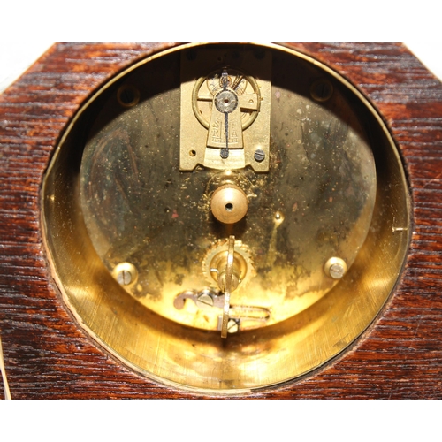 1301 - Small wooden mantel clock by Botley & Lewis of Reading with mechanical movement, approx 14cm tall