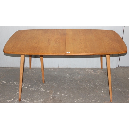 2 - A blonde Ercol extending dining table with 2 pull out leaves, approx 154cm (extending to 224cm) x 83... 