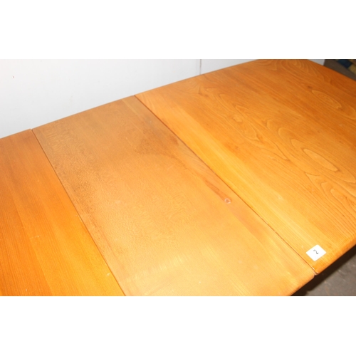 2 - A blonde Ercol extending dining table with 2 pull out leaves, approx 154cm (extending to 224cm) x 83... 