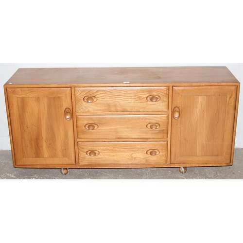 4 - A retro blonde Ercol 3 drawer 2 door sideboard, approx 155cm wide x 43cm deep x 67cm tall