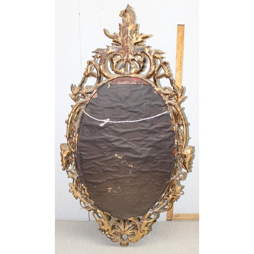 402 - A large antique carved giltwood wall mirror, likely 19th century in the Rococo manner, approx 110cm ... 