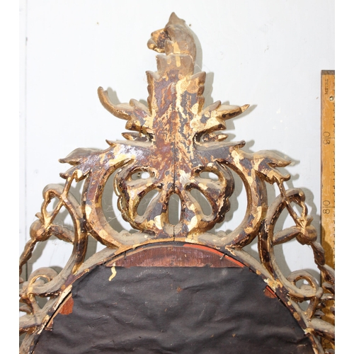 402 - A large antique carved giltwood wall mirror, likely 19th century in the Rococo manner, approx 110cm ... 