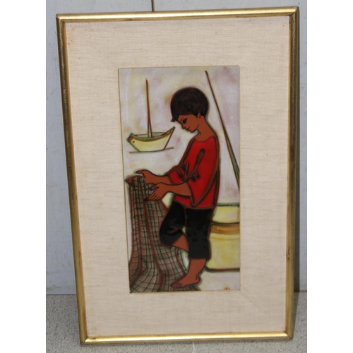 413 - Maria Lluis (b.1931), a retro framed pottery tile by Sant-Vicens depicting a fisherboy with net, app... 