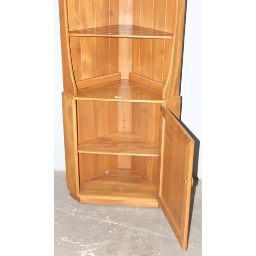 5 - A retro blonde Ercol corner display unit, approx 75cm wide x 40cm deep x 180cm tall