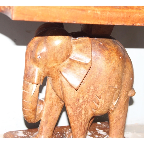 64 - An unusual vintage carved wooden table with elephant base, approx 77cm wide x 52cm deep x 54cm tall