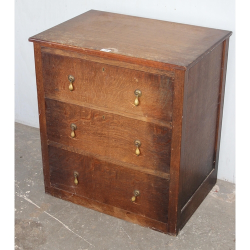 75 - A vintage oak 3 drawer chest of drawers with brass drop handles, approx 71cm wide x 49cm deep x 78cm... 