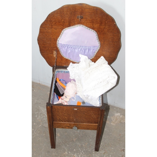 76 - A retro oak sewing box table on legs with contents, approx 48cm wide x 48cm deep x 48cm tall