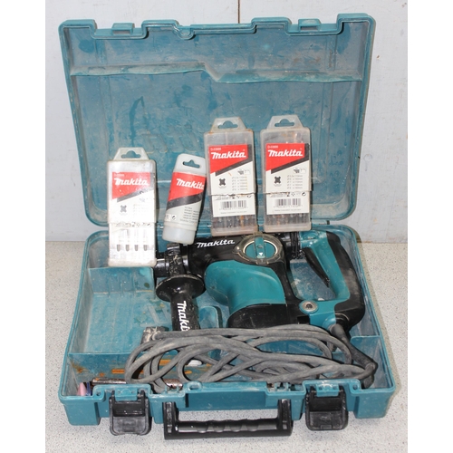 810 - Makita hammer drill in box