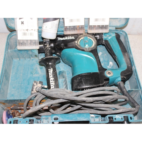 810 - Makita hammer drill in box