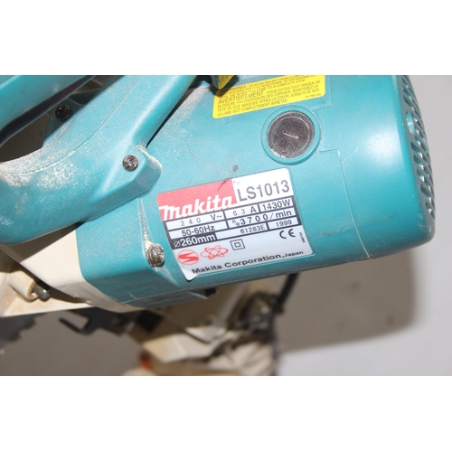 817 - Makita LS1013 chop saw on stand