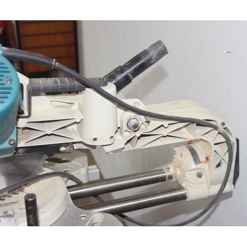 817 - Makita LS1013 chop saw on stand