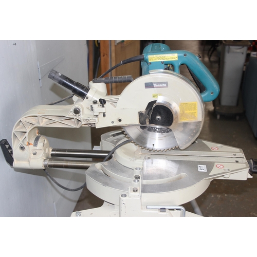 817 - Makita LS1013 chop saw on stand