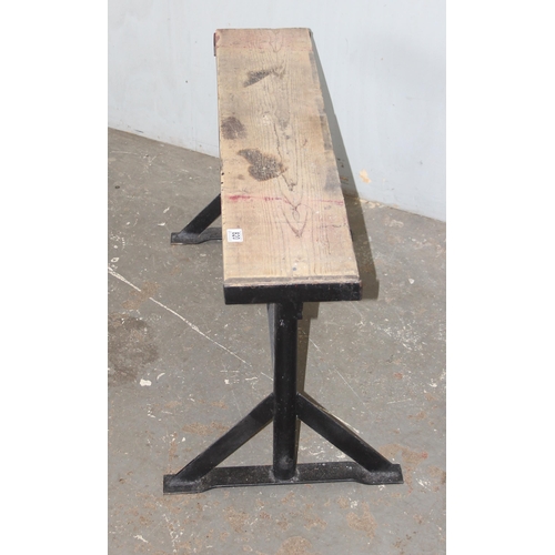 820 - A pine topped trestle stand with wrought iron base, approx 100cm wide x 22cm deep x 54cm tall