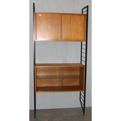 6 - Robert Heal for Staples of Cricklewood, a retro Ladderax modular unit with 2 wooden cupboards, appro... 