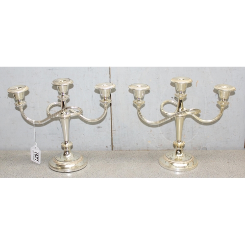 1021 - A pair of vintage silver plated 3 branch candelabra