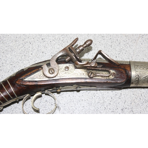 1425 - Rat-tail reproduction Albanian flintlock pistol with silver-plated decoration, approx 45cm