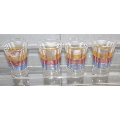 1616 - A set of 8 colourful retro French drinking tumblers