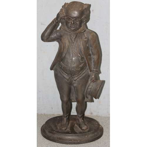 1738 - A vintage Mr Pickwick cast iron door stop or fire iron holder, approx 39cm tall