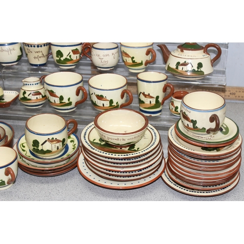 1740 - A huge qty of assorted Torquay mottoware pottery, dozens of pieces, 3 boxes