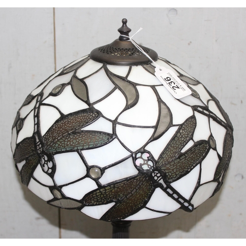 236 - A Tiffany style table lamp with leaded glass shade decorated with dragonfly, approx 50cm tall