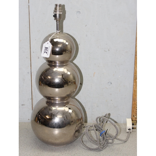 238 - A large designer chrome lamp base made from 3 graduated orbs, indistinctly signed to base, approx 52... 