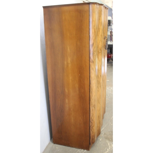 86 - A mid-century walnut veneered wardrobe with interior mirror, approx 125cm wide x 65cm deep x 184cm t... 