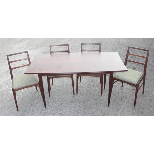 67A - Retro teak expending dining table with 4 chairs, seemingly unmarked but strongly believed to be by f... 