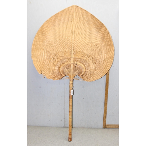 1801A - A large vintage wicker hand fan, approx 130cm tall