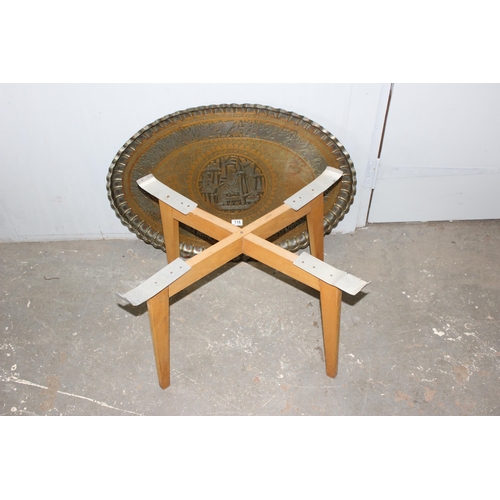 116 - A vintage brass tray topped Benares table, approx 84cm W x 62cm D x 51cm H