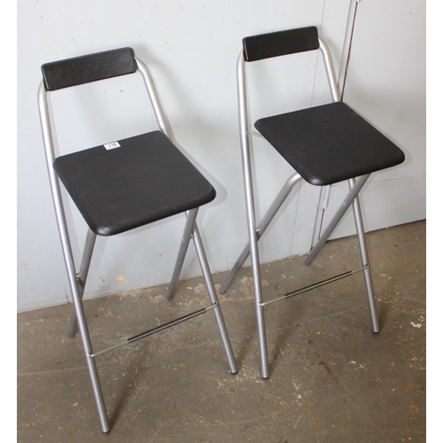 118 - Pair of black seated folding bar stools