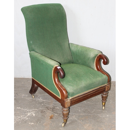 123 - George Minter of Soho - an unusual William IV period green upholstered and mahogany library armchair... 