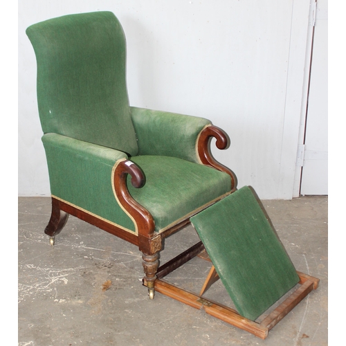 123 - George Minter of Soho - an unusual William IV period green upholstered and mahogany library armchair... 