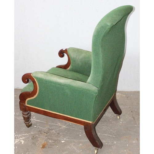 123 - George Minter of Soho - an unusual William IV period green upholstered and mahogany library armchair... 