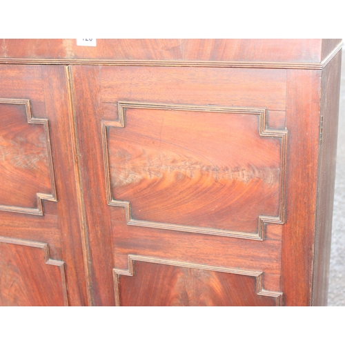 126 - Antique flamed mahogany closed fronted bookcase, approx 95cm W x 41cm D x 135cm H