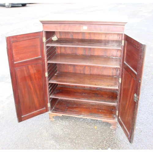 126 - Antique flamed mahogany closed fronted bookcase, approx 95cm W x 41cm D x 135cm H