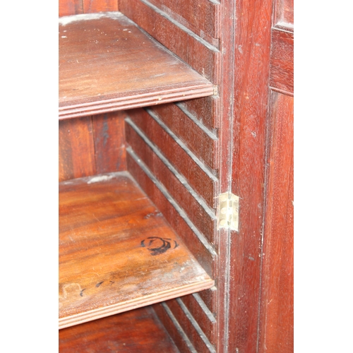 126 - Antique flamed mahogany closed fronted bookcase, approx 95cm W x 41cm D x 135cm H