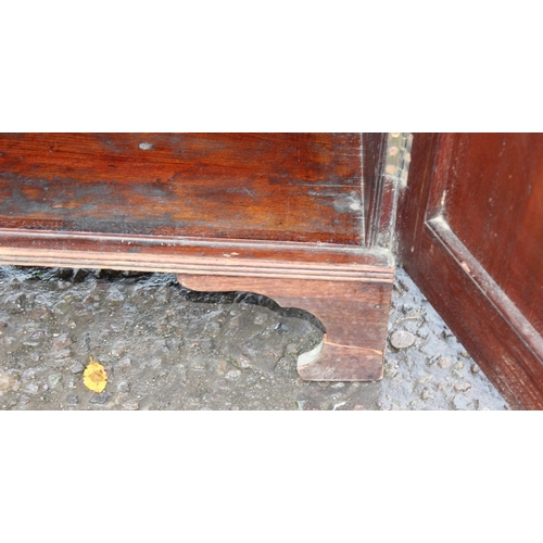 126 - Antique flamed mahogany closed fronted bookcase, approx 95cm W x 41cm D x 135cm H