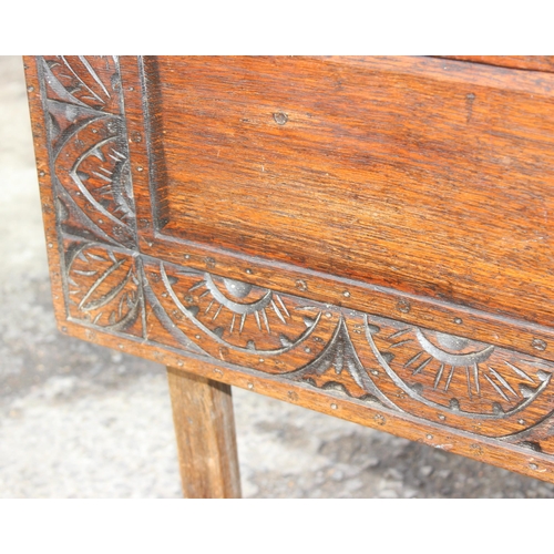 129 - Rustic oak single sided drop leaf table with hand carved border, approx 107cm W x 83cm D x 67cm H