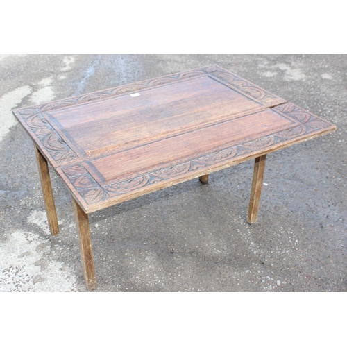 129 - Rustic oak single sided drop leaf table with hand carved border, approx 107cm W x 83cm D x 67cm H