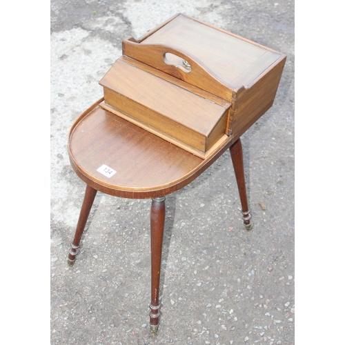 134 - Unusual Regency period mahogany butler's Canterbury or serving table, shaped top with removable box ... 