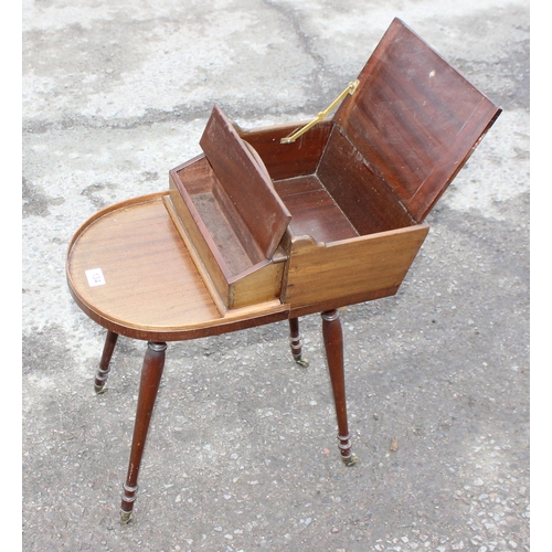 134 - Unusual Regency period mahogany butler's Canterbury or serving table, shaped top with removable box ... 