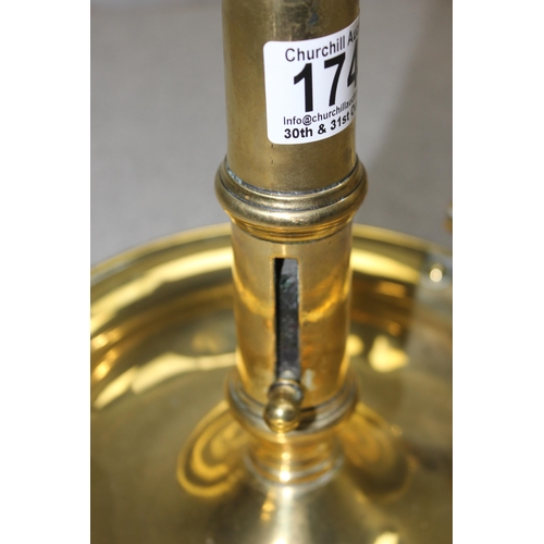 1744 - Large brass ejector candlestick holder, approx 20cm tall